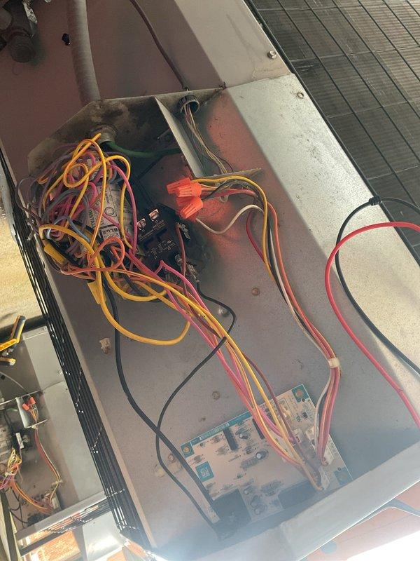 Completed monthly planned maintenance visit on Gold Level system over 10 years old. Performed comprehensive inspection of outdoor unit electrical control panel and indoor air handler components, documenting equipment condition with photographs. Verified all electrical connections, contactors, relays, and control wiring are secure and functioning properly, with no immediate safety concerns identified despite age-related weathering on exterior components.