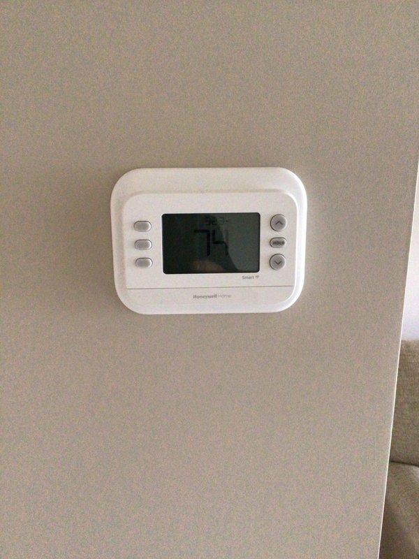 Completed dismissed visit on single-system residential property with 1-year-old Platinum equipment. Performed visual inspection of Honeywell Home Smart SI thermostat and exterior condensing unit. Collected air filter and confirmed annual maintenance agreement already renewed. Both indoor and outdoor components operating normally with no service interventions required at this time.
