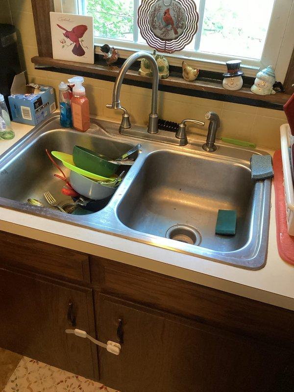 Conducted comprehensive plumbing estimate for gas tank-style water heater replacement in residential basement utility area. Assessed existing water heater installation, mechanical systems, and plumbing infrastructure including visible water supply lines and drainage configuration. Additionally provided consultation and pricing for water softener system installation to address hard water concerns.