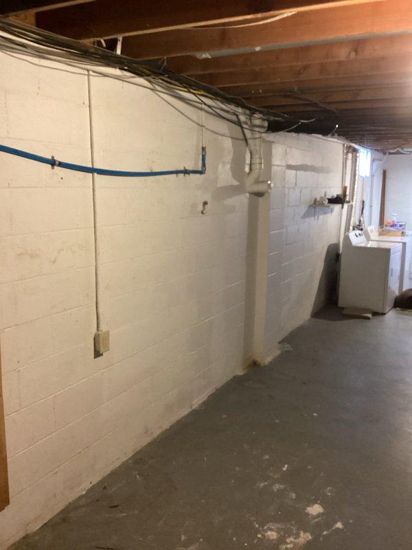 Conducted comprehensive plumbing estimate for gas tank-style water heater replacement in residential basement utility area. Assessed existing water heater installation, mechanical systems, and plumbing infrastructure including visible water supply lines and drainage configuration. Additionally provided consultation and pricing for water softener system installation to address hard water concerns.