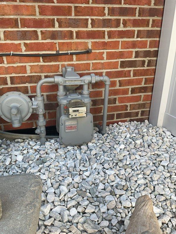 Conducted on-site electrical estimate for residential backup generator installation. Assessed existing natural gas meter configuration, breaker panel capacity, and exterior placement options adjacent to air conditioning unit. Documented utility connections, gas service infrastructure, and potential installation location to provide comprehensive generator system specifications.