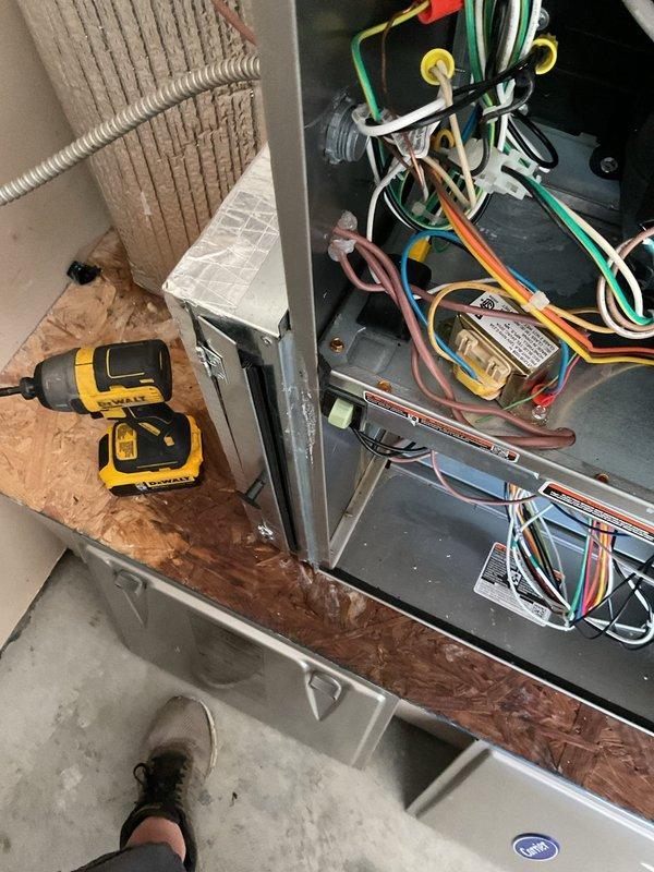 Responded to warranty service call for water leak issue on residential HVAC system. Diagnosed failed evaporator coil and thermal expansion valve (TXV) as source of refrigerant leak causing water accumulation. Documented unit model and serial number, photographed failed components and system configuration including outdoor condensing unit and indoor air handler wiring. Parts ordered under warranty for follow-up repair appointment estimated at half-day duration, system currently non-operational pending component replacement.