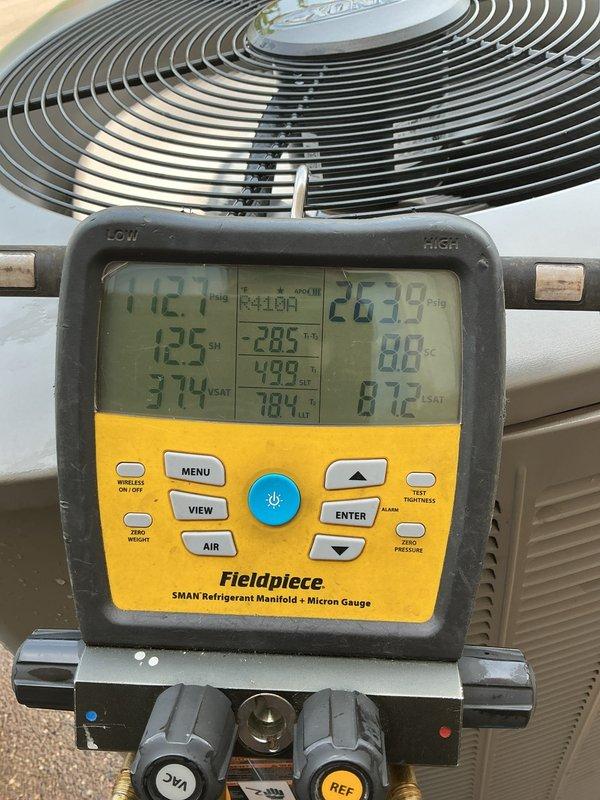 Completed annual planned maintenance visit on dual-system residential HVAC installation with Platinum level service coverage. Performed comprehensive inspection of both indoor air handler units and outdoor condensing units, including verification of refrigerant pressures and temperatures using calibrated manifold gauges. Systems showed proper superheat and subcooling values with readings of 112.1 PSIG and 263.9 PSIG respectively, indicating optimal refrigerant charge. Inspected PCO3-20-16 PURE AIR filtration systems on both units, verified proper operation of air purification equipment, and examined all ductwork connections with reflective insulation. Checked condensate drain lines for proper flow and drainage, inspected electrical connections, and confirmed fan motor operation on outdoor units. All components functioning within manufacturer specifications with no deficiencies noted.