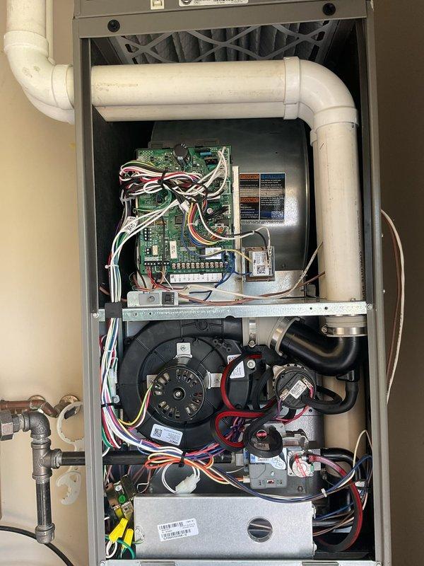 Completed annual planned maintenance visit on one-year-old residential HVAC system. Performed comprehensive inspection of vertically-mounted air handler and gas furnace assembly located in utility closet. Replaced 16x25x5 air filter as scheduled. Conducted thorough examination of internal components including blower motor assembly, control board with wiring connections, and gas valve assembly. Inspected PVC condensate drain lines and ventilation piping for proper operation. Verified all electrical connections, safety controls, and mechanical components functioning within normal parameters. System operational and ready for continued service. This represents the second annual maintenance visit; renewal recommended for continued coverage.