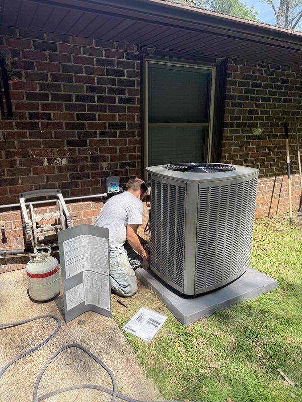 Completed installation of a 2-ton, 19 SEER heat pump system at residential property. Installed Lennox air handler unit in interior utility room with proper ductwork connections and filter compartment, and positioned outdoor heat pump condenser unit on concrete pad adjacent to home exterior with electrical disconnect box and all required connections completed per manufacturer specifications.