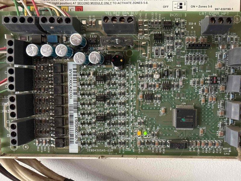 Responded to no cooling complaint on 3-year-old residential HVAC system with airflow present but inadequate cooling. Performed diagnostic evaluation of control board and zone control system, inspecting PCB components, capacitors, and terminal connections. Accessed attic-mounted equipment to examine zone damper actuator and verify proper mechanical operation and wiring connections.