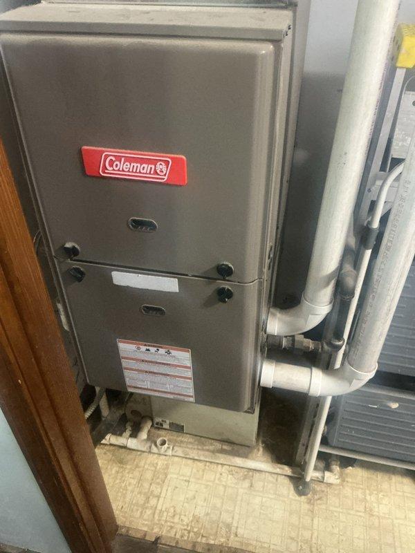 Responded to no cooling call on aging Coleman system with both indoor and outdoor units completely inoperative. Upon arrival, confirmed no power to furnace or condenser unit with no airflow through vents. Performed comprehensive diagnostic evaluation of electrical system, checking breakers, disconnect switches, and control circuits. Inspected Coleman furnace in utility closet and outdoor condenser unit positioned on exterior concrete pad. Tested voltage at multiple points, examined control boards, contactors, and safety devices. Assessed condition of both units and determined system had reached end of serviceable life due to age and component failure. Provided detailed findings and replacement options to property owner for complete HVAC system replacement.