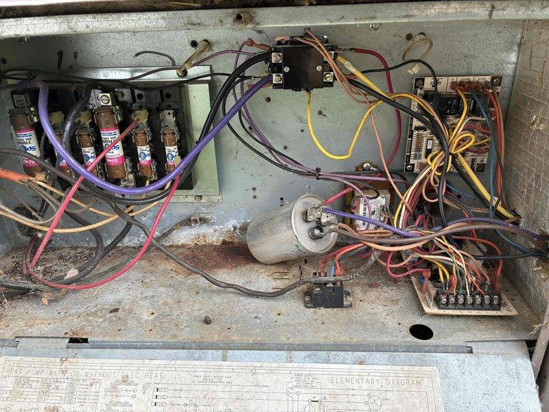 # HVAC Repair Completed

Responded to no cooling complaint on residential air conditioning system. Upon inspection, found evaporator coil assembly with significant corrosion and deterioration to surrounding metal housing and drain pan. Electrical control panel showed multiple signs of age-related wear including dust accumulation, oxidation on components, and disorganized wiring connections. 

Performed comprehensive diagnostic evaluation of the system. Tested capacitor functionality and verified all electrical connections at control board and terminal blocks. Inspected relay and contactor operation. Assessed evaporator coil for airflow restrictions and verified proper refrigerant circuit integrity. Cleaned accumulated debris from base pan and coil assembly.

Completed necessary repairs to restore cooling operation. System tested and verified operational upon completion. Total repair time: 2 hours.