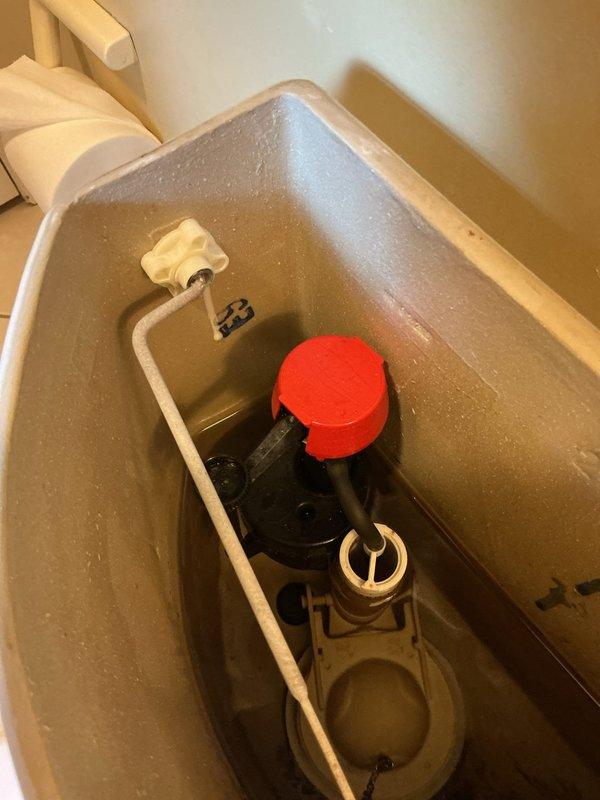 Responded to master bathroom for clogged toilet complaint. Inspected two-piece elongated bowl toilet with standard flush mechanism. Removed obstruction from drain line using appropriate clearing tools, restoring proper drainage and flush function. Tested flush valve, fill valve, and flapper assembly for proper operation. Verified complete water flow and drainage cycle upon completion.