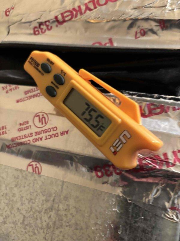 Performed comprehensive AC tune-up on 16-year-old cooling system experiencing slow cooling performance affecting entire home. Conducted thorough system diagnostics including temperature differential measurements across supply and return ducts, recording -8.5°F split at one measurement point and 155°F reading at another location. Inspected all accessible ductwork and insulation for proper installation and integrity. Evaluated system performance parameters to identify causes of inadequate cooling capacity. Completed standard preventive maintenance procedures including filter inspection, electrical connections check, refrigerant level assessment, and overall system operation verification. Observed customer's request for protective foot coverings throughout service visit. Documented findings with photographic evidence of diagnostic measurements and system components for service records.