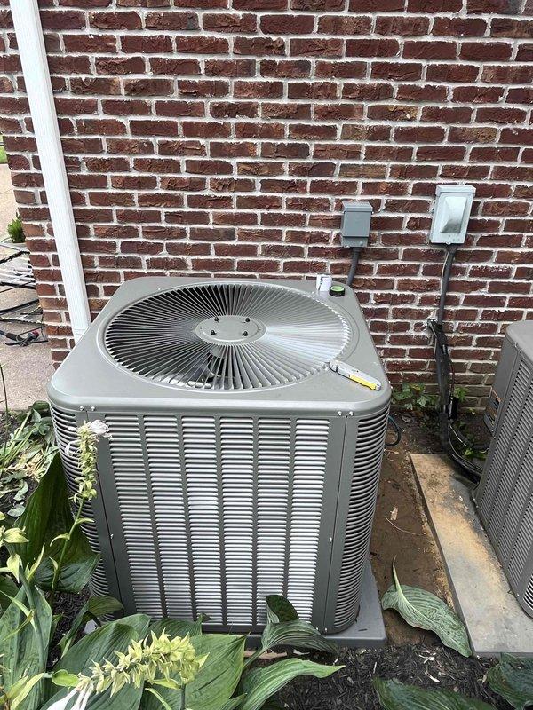 Completed full HVAC system installation including a 4-ton, 15.5 SEER outdoor condensing unit and a 97% AFUE gas furnace model EL297DF090XE48C-01. The outdoor unit was positioned on a concrete pad against the brick exterior with proper clearances maintained for airflow and serviceability. All electrical connections were completed per manufacturer specifications, with disconnect box and weatherproof outlet cover mounted to exterior wall. Indoor furnace installation included proper venting, gas line connections, and integration with existing ductwork. System was charged, tested for proper operation, and all safety controls verified functional before final commissioning.