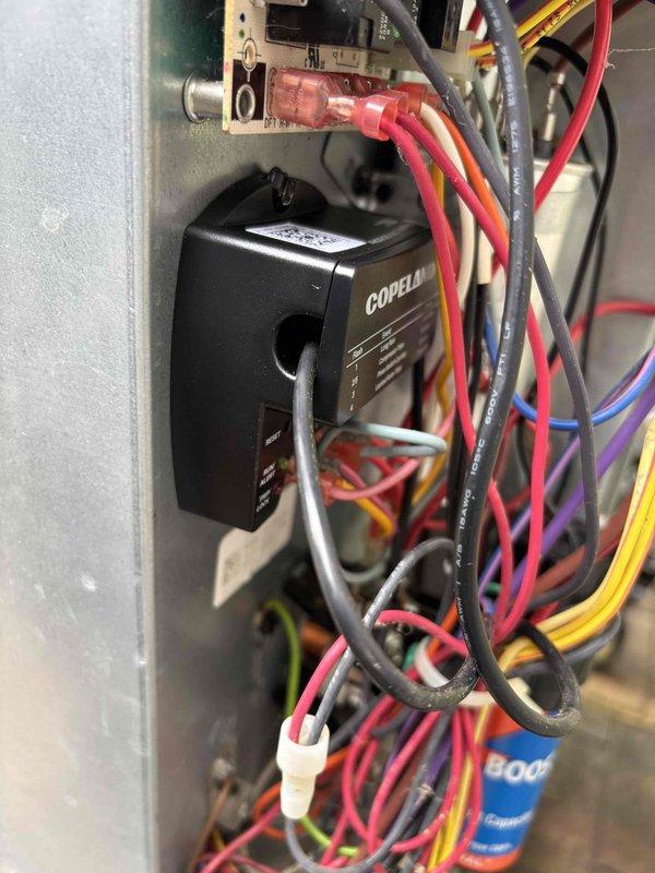 Diagnosed failed CoreSense diagnostic board on Copeland scroll compressor system. Confirmed board malfunction through visual inspection and LED diagnostic indicators. Part ordered for replacement to restore proper compressor monitoring and protection functions.