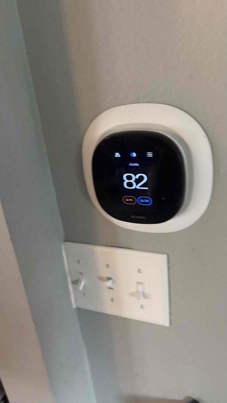 Completed comprehensive HVAC system replacement estimate for non-operational residential heating and cooling system requiring immediate replacement. Evaluated existing equipment condition, assessed installation site including indoor thermostat location and outdoor unit placement area adjacent to brick exterior wall, documented current system configuration, and provided detailed replacement options for complete system changeover.