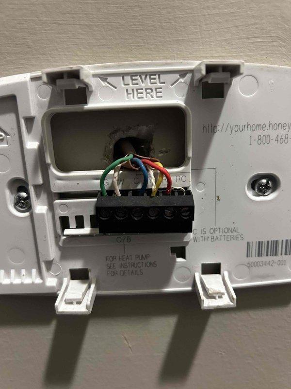 Responded to service call for 10-year-old HVAC system continuously running with thermostat set to 75°F while indoor temperature had dropped to 68°F. Upon inspection, diagnosed faulty thermostat failing to signal compressor to cycle off when setpoint was reached. Removed malfunctioning thermostat from wall, verified wiring connections at terminal block, and installed replacement thermostat. Tested system operation through multiple cooling cycles to confirm proper communication between thermostat and HVAC unit, verifying unit now cycles on and off correctly at desired temperature setpoint.