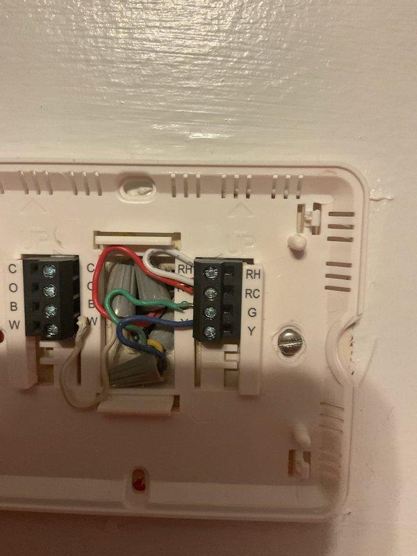 Conducted comprehensive replacement estimate for non-operational residential air conditioning system. Evaluated existing outdoor condensing unit mounted on brick platform against house exterior, assessed electrical conduit and disconnect box configuration, and inspected indoor thermostat wiring connections to determine compatibility requirements for new equipment installation.