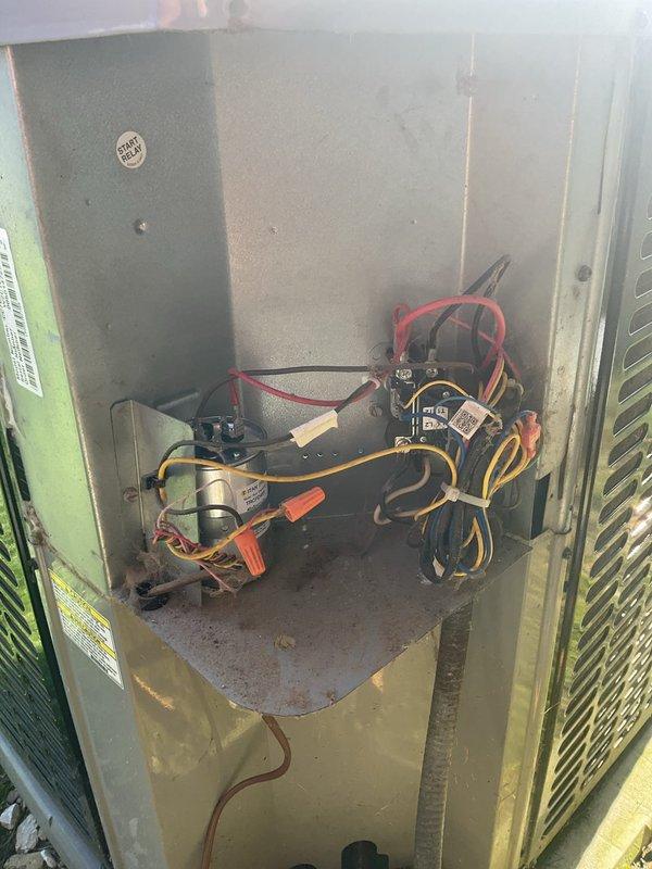 Responded to no cooling complaint on 6-year-old residential air conditioning system with thermostat set to 70°F but home temperature at 75°F. Upon inspection, tested the outdoor unit's capacitor using multimeter and found failed capacitor with 0.000 reading. Replaced defective capacitor, verified proper electrical connections, and restored system to normal cooling operation.