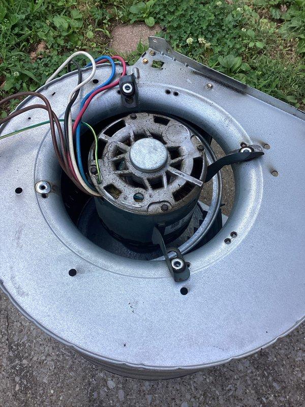 Responded to no cooling complaint on residential HVAC system. Upon inspection, diagnosed failed blower motor assembly with compromised blower wheel showing excessive dirt accumulation and motor failure. Removed blower motor and wheel assembly from air handler for replacement. Documented model and serial number information, took measurements of ductwork clearances, and photographed failed components. Parts have been ordered for follow-up installation requiring approximately 90 minutes for completion.