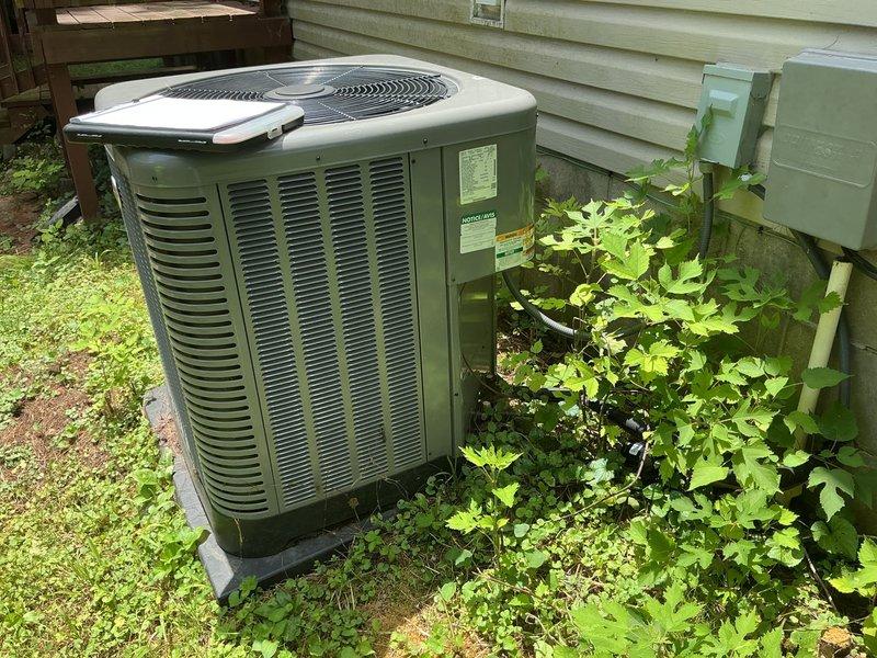 Conducted on-site evaluation for all-electric air handler replacement at residential property with 2200+ square foot heating and cooling system. Existing outdoor Rheem heat pump condenser unit (approximately 2 years old) assessed and determined to be in serviceable condition. Interior air handler located in closet requires replacement to complete split system configuration. Documented existing equipment including evaporator coil assembly with copper refrigerant lines and provided comprehensive estimate for new air handler installation compatible with current outdoor unit specifications.