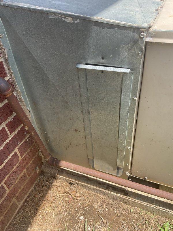 Conducted replacement estimate for aging package unit experiencing refrigerant leaks. System displayed significant exterior corrosion, rust staining around fan assembly, and deteriorated metal casing with paint failure. Homeowner currently utilizing portable air conditioning units due to system failure. Documented unit condition with photographs showing extensive weathering on outdoor equipment positioned on concrete pad against brick structure. Provided comprehensive replacement options as repair was not requested due to extent of system degradation.