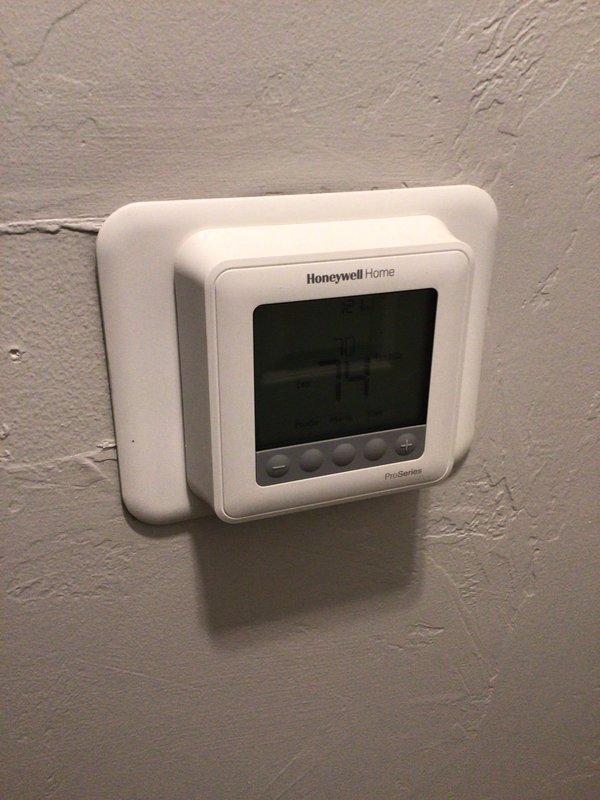Responded to service call for 15-year-old HVAC system producing excessive noise during operation, described as similar to an off-balance dryer. Upon arrival, performed diagnostic inspection of furnace and associated equipment in basement utility area. Evaluated system operation, inspected blower assembly, motor bearings, and mechanical components to identify source of abnormal sound. System remained operational and cooling effectively throughout inspection. Documented equipment condition including Honeywell thermostat, furnace unit with PVC venting system, and condensate pump assembly.