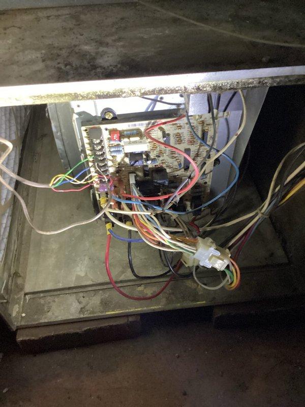 Responded to no-cool call on older gas furnace system located in basement. Upon arrival, confirmed unit was completely non-operational with no power to system. Conducted comprehensive diagnostic inspection of all electrical components, control board, transformer, and safety circuits. Visually inspected blower motor assembly, burner assembly, and all internal mechanical components for signs of failure or damage. Investigated reported occasional gas odor in basement area and performed safety assessment of gas connections and burner manifold. Checked electrical panel breakers and verified proper voltage supply to unit. Examined control board wiring, connections, and circuit integrity throughout system. Documented equipment condition showing significant age-related wear, dust accumulation, and component deterioration. Photographed internal components including blower motor, control boards, burner assembly, and wiring configurations for service records. Provided customer with findings and r
