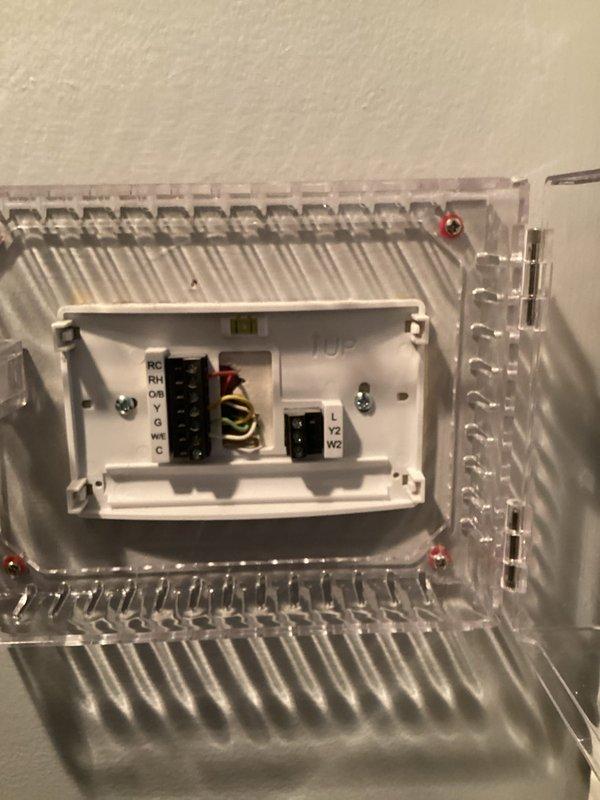 Responded to no-cooling call on 15-year-old residential HVAC system running continuously without achieving setpoint. Upon arrival, found unit unable to maintain 75°F setpoint with indoor temperature at 78°F. Performed comprehensive system diagnostics including thermostat operation verification, electrical connections inspection, and control wiring assessment. Documented existing Emerson digital thermostat installation and terminal connections for reference. System evaluated for proper communication between thermostat and air handler. Identified cooling system deficiency preventing adequate temperature drop despite continuous operation.