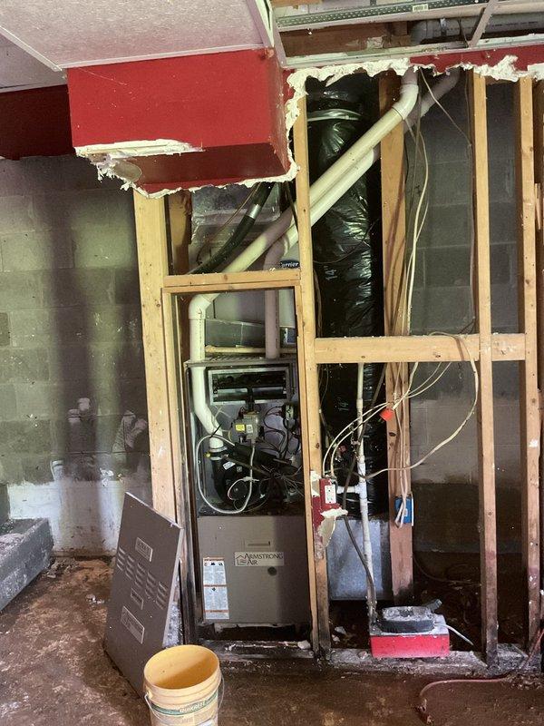 Completed comprehensive HVAC system replacement estimate for non-functioning air conditioning unit with reported fan blade damage and suspected refrigerant deficiency. Inspected 5-10 year old outdoor condenser unit and indoor furnace system, documented existing equipment condition including damaged components, assessed ductwork and electrical connections in exposed utility area. Provided detailed replacement recommendations and equipment specifications for complete system upgrade.