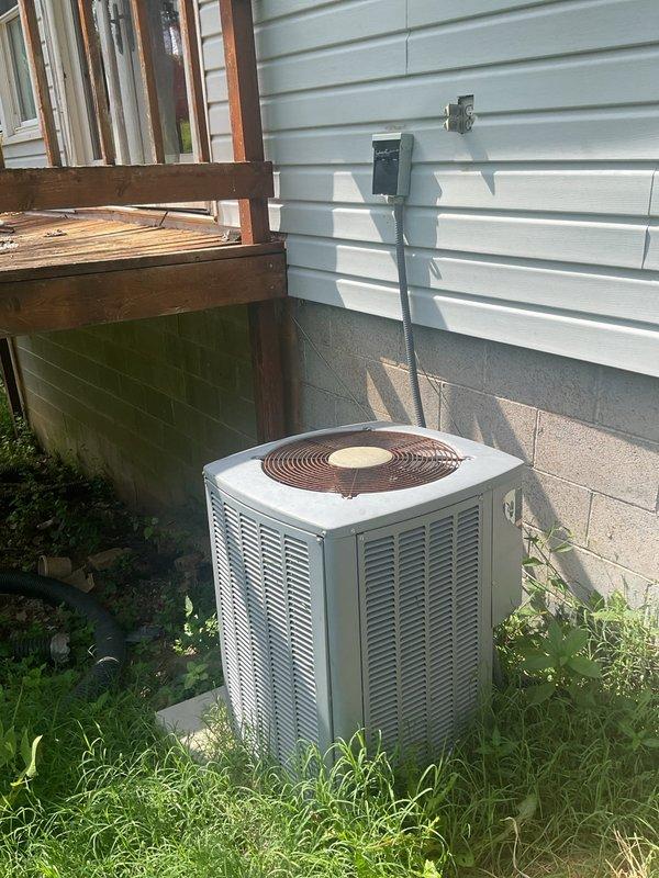Completed comprehensive HVAC system replacement estimate for non-functioning air conditioning unit with reported fan blade damage and suspected refrigerant deficiency. Inspected 5-10 year old outdoor condenser unit and indoor furnace system, documented existing equipment condition including damaged components, assessed ductwork and electrical connections in exposed utility area. Provided detailed replacement recommendations and equipment specifications for complete system upgrade.