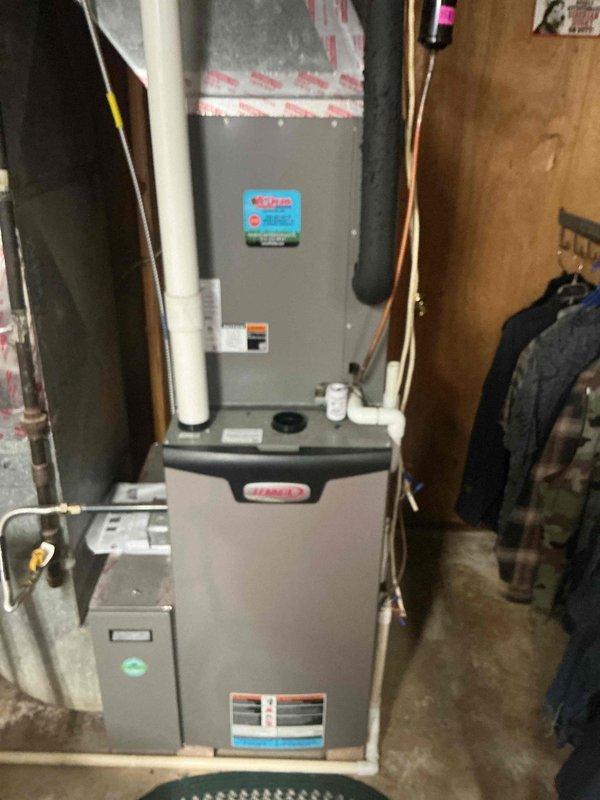 Responded to no cooling complaint on 3-year-old Lennox residential system with no airflow and indoor temperature reading 88°F with thermostat set to 79°F. Upon arrival, confirmed complete loss of airflow from supply vents with no breakers tripped. Performed diagnostic inspection of furnace and air handler assembly located in basement utility area. Accessed control board compartment and identified failed blower motor relay on integrated furnace control board preventing blower operation. Tested voltage supply to board confirming proper 24VAC from transformer and 120VAC line voltage present. Verified blower motor capacitor tested within acceptable range and motor windings showed proper resistance values, isolating failure to control board relay contacts. Replaced defective integrated furnace control board, reconnected all low voltage thermostat wiring and line voltage connections to blower motor assembly. Cycled system through complete operational test in cooling mode, confirmed proper bl