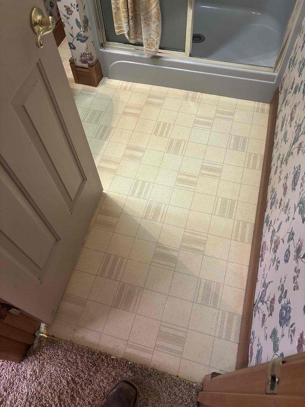 Conducted follow-up site visit to document bathroom conditions and verify accessibility for pending HVAC installation work. Photographed existing bathroom layout, including shower enclosure, flooring, and wall conditions to assess clearances and identify any potential obstacles for equipment placement or ductwork routing.