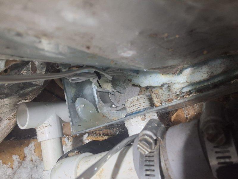 Responded to callback for unit not cooling properly. Upon inspection, discovered extensive corrosion and rust throughout the system components, including deteriorated metal ductwork housing and compromised drainage piping. Documented severe moisture damage, mineral deposits, and debris accumulation affecting mechanical assembly performance, indicating prolonged exposure to water intrusion and lack of preventative maintenance requiring further evaluation and repair recommendations.
