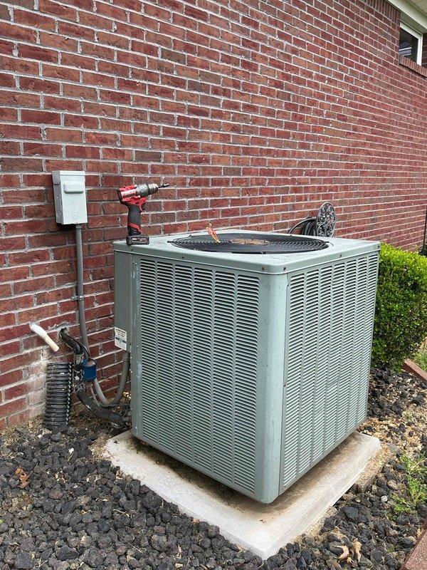 Conducted comprehensive site evaluation for complete HVAC system replacement. Assessed existing outdoor condensing unit positioned on concrete pad against brick exterior, documented current electrical disconnect box and refrigerant line routing. Evaluated indoor gas line infrastructure including existing shutoff valve and flexible connector configuration where lines penetrate through ceiling. Captured detailed measurements and photographic documentation of both outdoor and indoor components to provide accurate equipment specifications and installation requirements for A+ rated energy-efficient system replacement estimate.