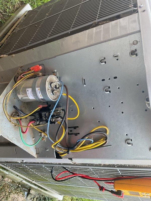 # HVAC Service Report

Responded to no cooling complaint on 8-year-old residential air conditioning system affecting entire home. Upon arrival, confirmed no cold air delivery and absence of ice buildup at indoor unit. 

Performed diagnostic inspection of outdoor condensing unit, accessing electrical components to test capacitor functionality and verify proper voltage delivery to compressor and fan motor. Inspected wiring connections, relay operation, and internal electrical components. Evaluated Carrier indoor furnace system and air handler operation, checking airflow and filter condition.

Identified failed capacitor as root cause of cooling failure. Replaced defective dual-run capacitor with manufacturer-specified replacement, restoring power to compressor and condenser fan motor. Verified proper amperage draw on all components, confirmed refrigerant pressures within normal operating range, and tested system through complete cooling cycle. System restored to full operational status w