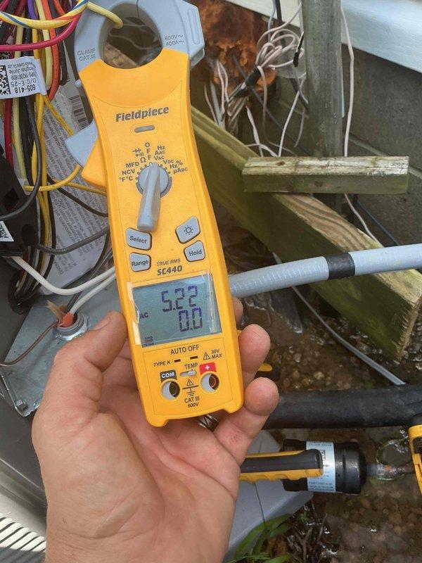 # HVAC Maintenance Completed

Performed planned preventative maintenance on residential HVAC system. Conducted comprehensive electrical diagnostics using clamp meter to verify system performance. Measured and recorded compressor amperage draw at 8.18 amps and supply voltage at 522 volts, confirming equipment operating within manufacturer specifications. Inspected capacitor connections and verified all electrical terminals secure with proper wire routing. Examined refrigerant line insulation for deterioration and checked copper tubing for signs of wear or damage. All components functioning properly with no deficiencies noted at time of inspection.