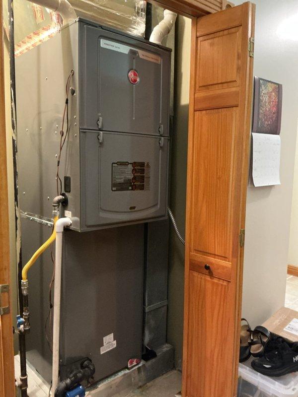 Responded to no cooling complaint on 9-year-old Rheem Prestige Series system that had been running continuously for three days with thermostat set to 70°F while indoor temperature reached 82°F. Upon arrival, confirmed weak airflow from supply vents with no ice buildup present and no tripped breakers. Performed diagnostic evaluation of furnace and air handler installed in utility closet, inspecting blower assembly, evaporator coil accessibility, and condensate drainage system. Assessed outdoor condensing unit operation, refrigerant pressures, and electrical connections. Identified root cause of cooling failure and presented repair options to restore proper system operation and adequate airflow.