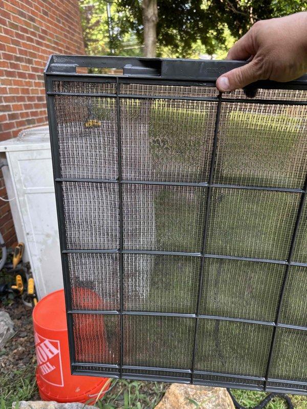 # HVAC Maintenance Service Completed

Performed comprehensive planned maintenance service on a 21-year-old residential HVAC system under Gold Level service agreement. Conducted thorough system inspection and testing procedures to ensure optimal performance and reliability.

## Work Performed

**Filter Service:**
- Removed and inspected existing air filter, which exhibited heavy contamination with dust, debris, and significant pollen accumulation
- Filter showed discoloration with reddish-brown staining and greenish-yellow buildup indicating extended service interval
- Replaced dirty filter with new unit to restore proper airflow and indoor air quality

**Electrical Diagnostics:**
- Performed voltage testing using calibrated digital multimeter on system electrical components
- Tested multiple wire circuits including power supply and control wiring
- Verified electrical connections and wire terminations within equipment enclosure
- Documented voltage readings to establish baseline perfor