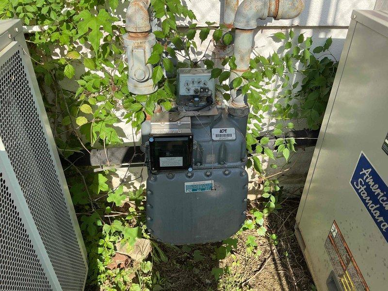 Conducted comprehensive HVAC replacement estimate for non-functional residential system. Evaluated existing American Standard outdoor condensing unit and associated equipment positioned in exterior utility area alongside natural gas meter infrastructure. Assessed site conditions including equipment accessibility, vegetation overgrowth around units, and proper clearances for replacement installation. Documented current system configuration and photographed equipment specifications, manufacturer data plates, and installation environment to develop complete replacement proposal. Homeowner declined repair options and requested replacement estimate only.