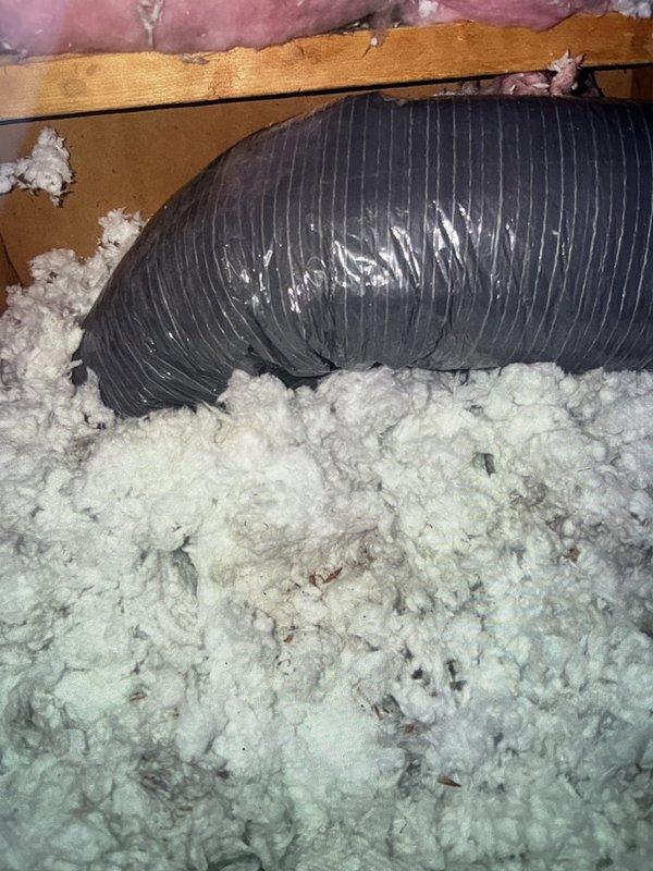 Responded to callback for water leak dripping from bathroom ceiling. Accessed attic space and inspected HVAC flexible ductwork and insulation. Located source of moisture intrusion affecting bathroom vent system. Documented existing conditions including flexible duct routing, insulation placement, and structural components. Verified ductwork installation and identified areas requiring correction to prevent continued condensation and water damage to ceiling below.