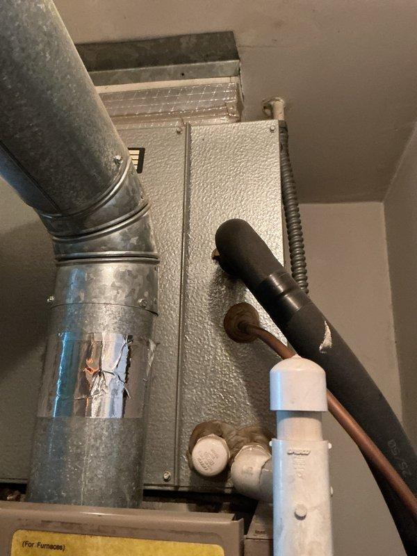 Conducted comprehensive HVAC system replacement estimate at residential property. Evaluated existing outdoor condensing unit positioned on concrete pad adjacent to brick wall, as well as indoor air handler installation with associated ductwork, refrigerant lines, and condensate drainage system. Documented current equipment configuration, spatial constraints, and mechanical room layout to provide homeowner with replacement options and system upgrade recommendations.