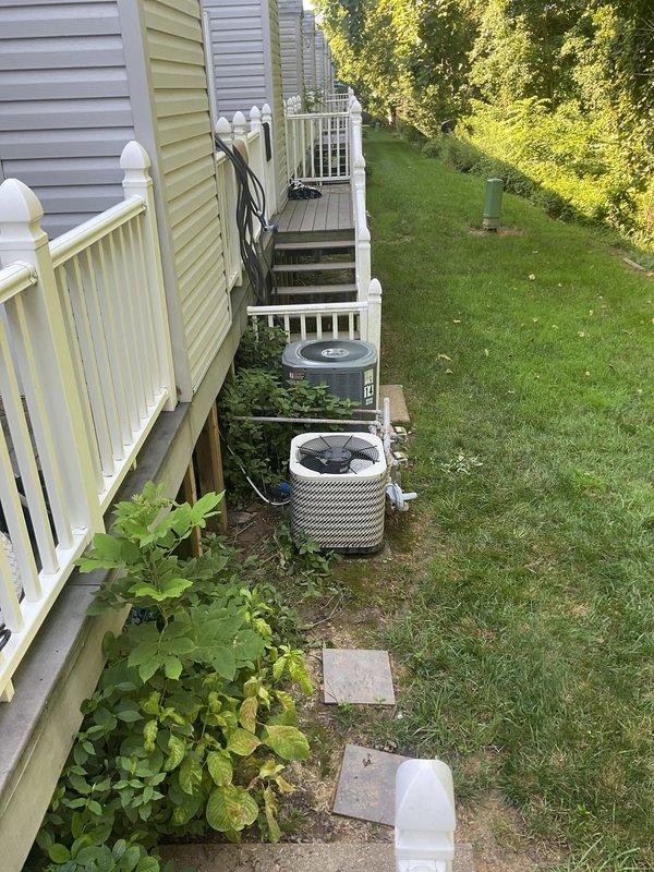 Responded to no cooling complaint on residential HVAC system. Upon inspection, found existing Goodman furnace and outdoor condensing units with airflow present but no cooling capability. Evaluated system age, operational status, and overall condition of both indoor and outdoor equipment. Documented equipment placement in side yard and mechanical room configuration. Provided comprehensive replacement estimate for complete HVAC system upgrade due to system failure and age-related deterioration.
