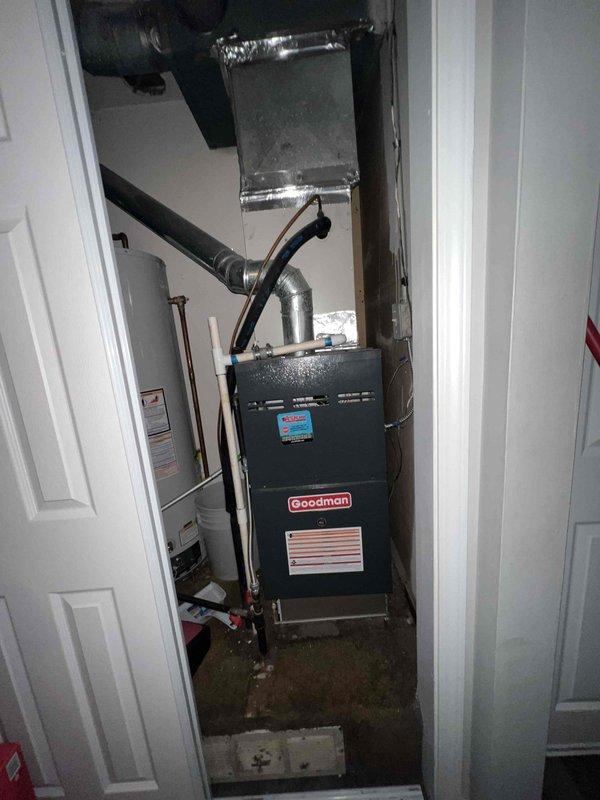 Responded to no cooling complaint on residential HVAC system. Upon inspection, found existing Goodman furnace and outdoor condensing units with airflow present but no cooling capability. Evaluated system age, operational status, and overall condition of both indoor and outdoor equipment. Documented equipment placement in side yard and mechanical room configuration. Provided comprehensive replacement estimate for complete HVAC system upgrade due to system failure and age-related deterioration.