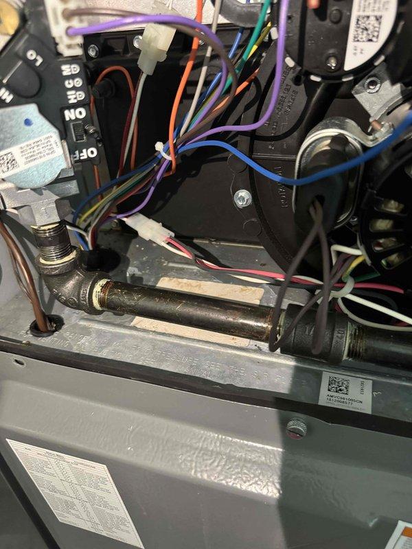 Responded to service call for rust staining below HVAC unit flagged on inspection report. Upon arrival, performed visual inspection of system interior components including blower motor assembly, electrical connections, and drainage system. Documented existing conditions with photographs showing internal compartment, wiring configurations, control board, gas line connections, and condensate drainage components. System confirmed operational for both heating and cooling functions at time of inspection.
