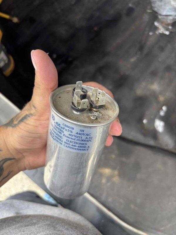 Responded to no cooling complaint on 5-year-old residential HVAC system with thermostat set to 76°F but indoor temperature reading 80°F. Upon arrival, verified system was not cooling and no breakers had tripped. Connected digital manifold gauges to measure refrigerant pressures, which revealed abnormal readings of 141.8 psi on low side and 308.2 psi on high side. Diagnosed failed dual-run capacitor as root cause of cooling failure. Removed defective 40/7.5 MFD 440VAC capacitor and replaced with new unit to restore proper compressor and condenser fan motor operation. System tested and verified operational with proper cooling restored.