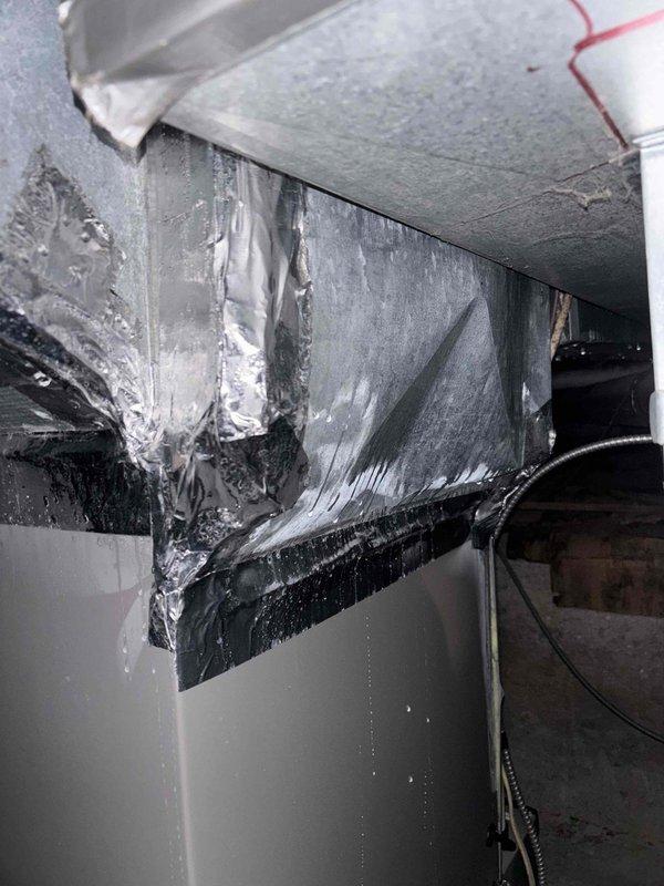 Completed callback service to address air leakage issues in supply plenum system causing inadequate cooling performance. Sealed gaps and joints in sheet metal ductwork using professional-grade foil tape to eliminate air loss. Addressed severe condensation and ice buildup on horizontal supply duct run, indicating previous air leakage allowing humid air infiltration into cold plenum space. Inspected refrigerant lines and insulation integrity at penetration points. Coordinated with management regarding ongoing temperature control concerns and verified system airflow improvements following repairs.