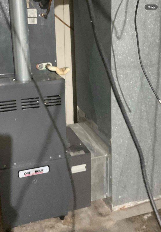 Completed comprehensive replacement estimate for residential HVAC system that has been non-operational for approximately one year. Assessed existing furnace and ductwork configuration in basement mechanical room, documenting current equipment condition including dark gray furnace unit with metal supply ductwork, electrical connections, and surrounding insulated enclosure. Evaluated replacement options and financing solutions for complete system installation to restore climate control functionality, as property currently relies on temporary window unit cooling.