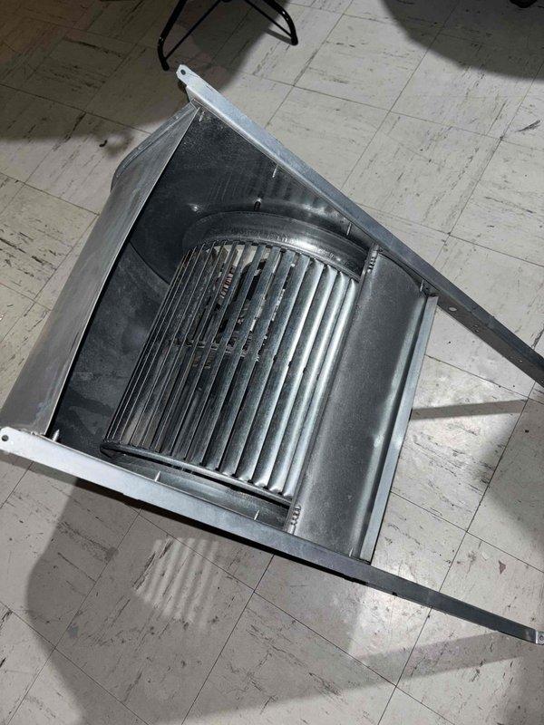 Completed follow-up service visit to address previously identified HVAC system repairs. Removed and inspected blower assembly housing with centrifugal squirrel cage fan, noting dust accumulation on fan blades and interior surfaces requiring cleaning. Disassembled ductwork components including metal transition piece with oval cutout for thorough assessment and repair work as originally quoted.