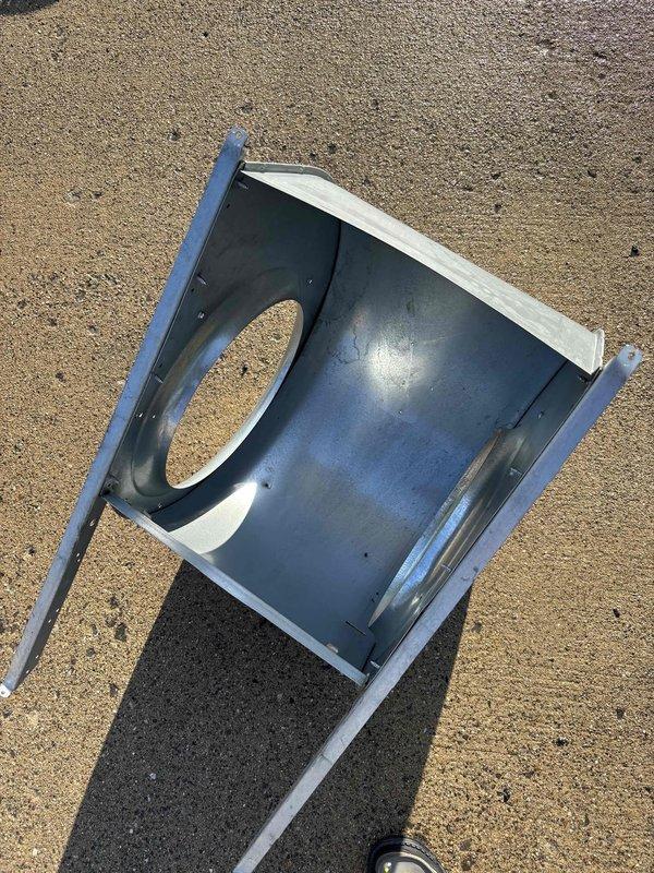 Completed follow-up service visit to address previously identified HVAC system repairs. Removed and inspected blower assembly housing with centrifugal squirrel cage fan, noting dust accumulation on fan blades and interior surfaces requiring cleaning. Disassembled ductwork components including metal transition piece with oval cutout for thorough assessment and repair work as originally quoted.