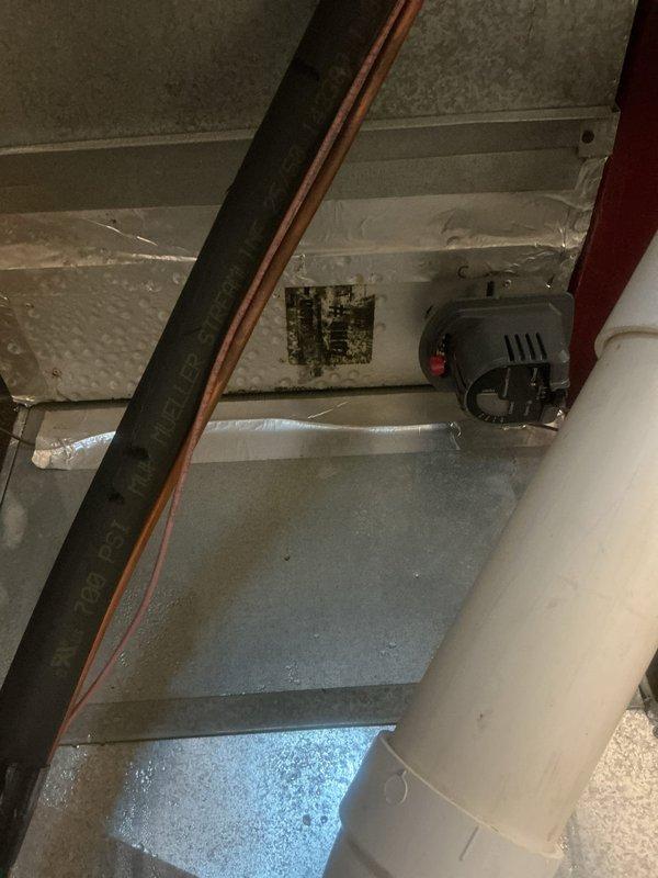 Responded to water leak emergency at property with multiple HVAC systems, primary unit approximately 15 years old. Unit located in upstairs mechanical space was actively leaking into kitchen area below, causing visible ceiling damage. Upon arrival, conducted thorough inspection of upstairs HVAC equipment and surrounding infrastructure.

Identified source of water intrusion originating from air handling unit and associated condensate system. Inspected primary drain line, secondary drain line, and drain pan for blockages, cracks, or overflow conditions. Examined evaporator coil housing and condensate collection system for proper operation. Assessed extent of water damage to ceiling materials in kitchen directly below the mechanical space.

Advised immediate system shutdown to prevent additional water damage to structure and interior finishes. Documented existing conditions with photographic evidence showing mechanical room layout, ductwork configuration, copper refrigerant lines, and con