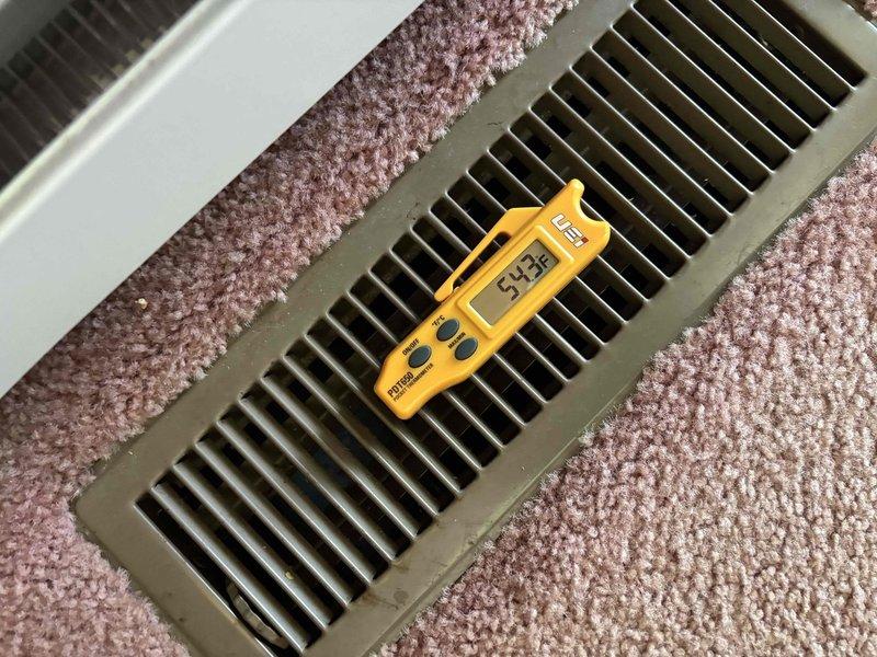 Responded to callback for inadequate cooling on 5-year-old AC system. Connected digital manifold gauges to measure refrigerant pressures, recording 68.4 PSI suction and 275.4 PSI discharge with suction line temperature of -7.9°F. Verified airflow at floor register measuring 53.3°F supply air temperature. Diagnosed and addressed cooling deficiency to restore proper system operation throughout home.