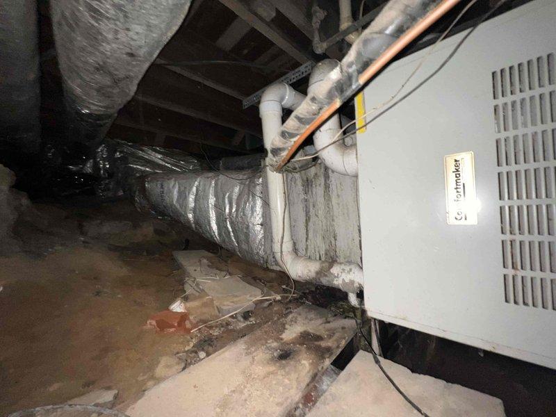 Conducted comprehensive assessment of 18-year-old cooling system located in basement crawl space of large residential property exceeding 2,200 square feet. Evaluated existing air handling unit, ductwork infrastructure, and overall system condition to provide complete replacement estimate. Documented equipment specifications, existing installation configuration, flexible duct conditions, and accessibility constraints within confined crawl space environment for full system replacement proposal.